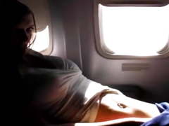 Pretty blonde slut is touching and fingering in an airplane